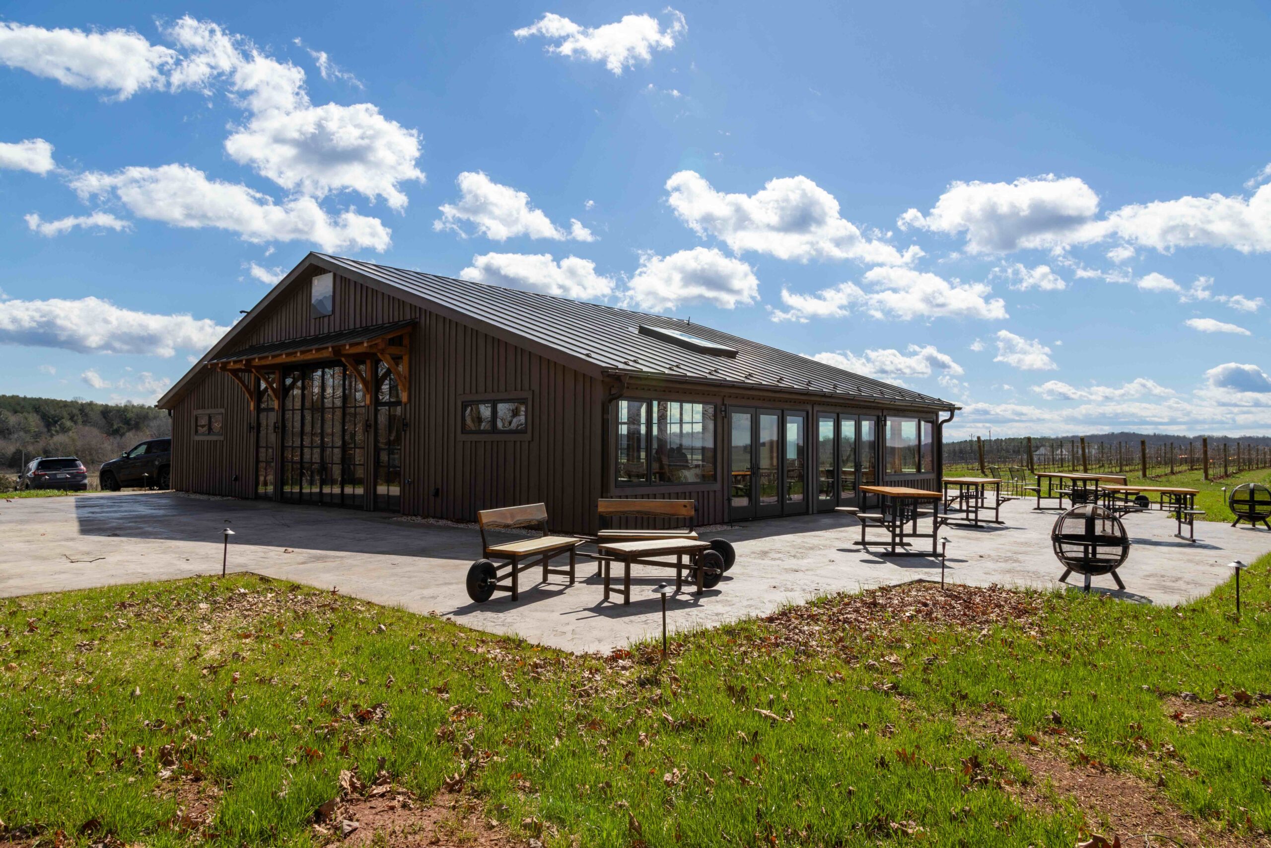a building on a sunny day with clouds in the sky