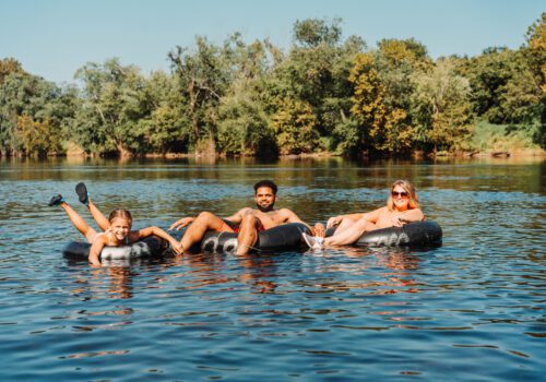 Family tubing in water Image