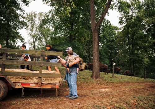 children getting on hay ride at farm tour Image