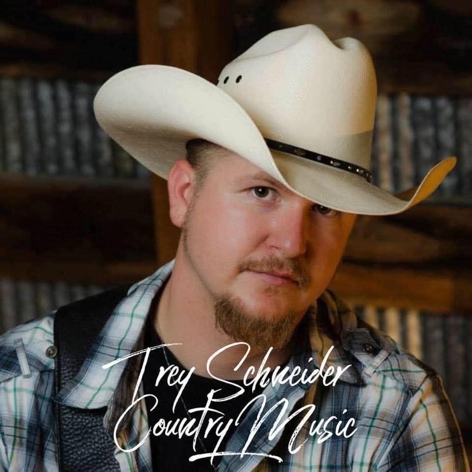 Image of Trey Schneider with a cowboy hat on