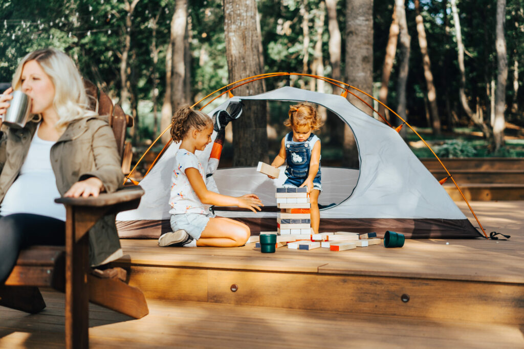 woman and children at a a campsite