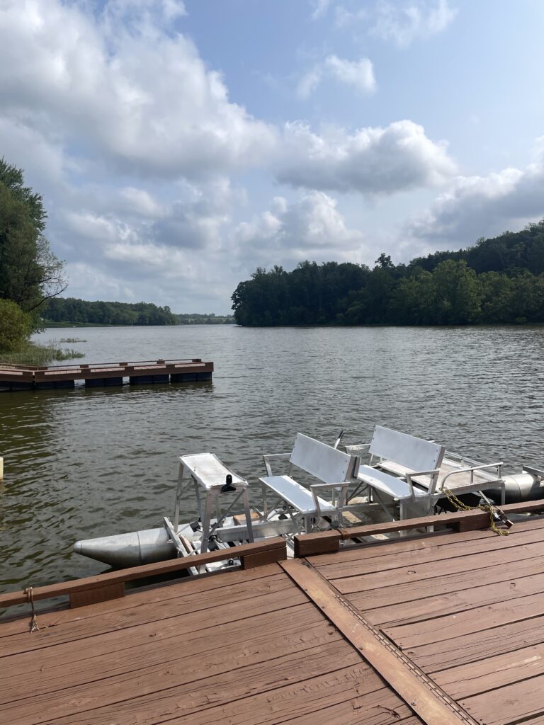 paddleboat on the water next to a dock
