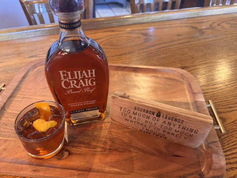 a bottle of Elijah Craig and an Old Fashioned