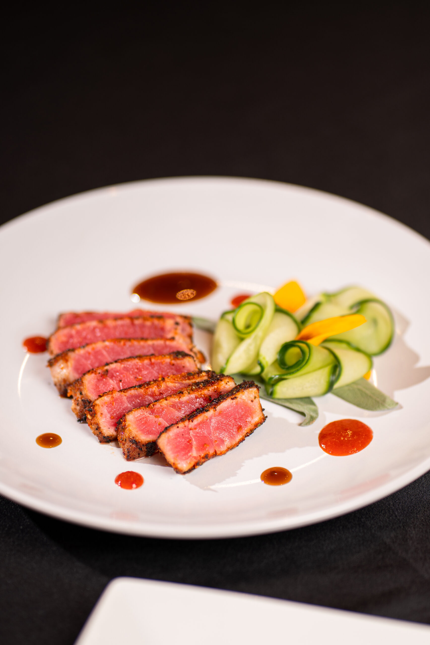 red meat dish with green garnish