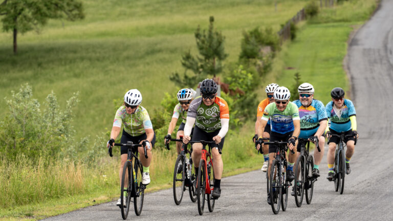 group of people road cycling